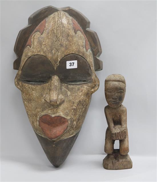 A tribal carving and mask